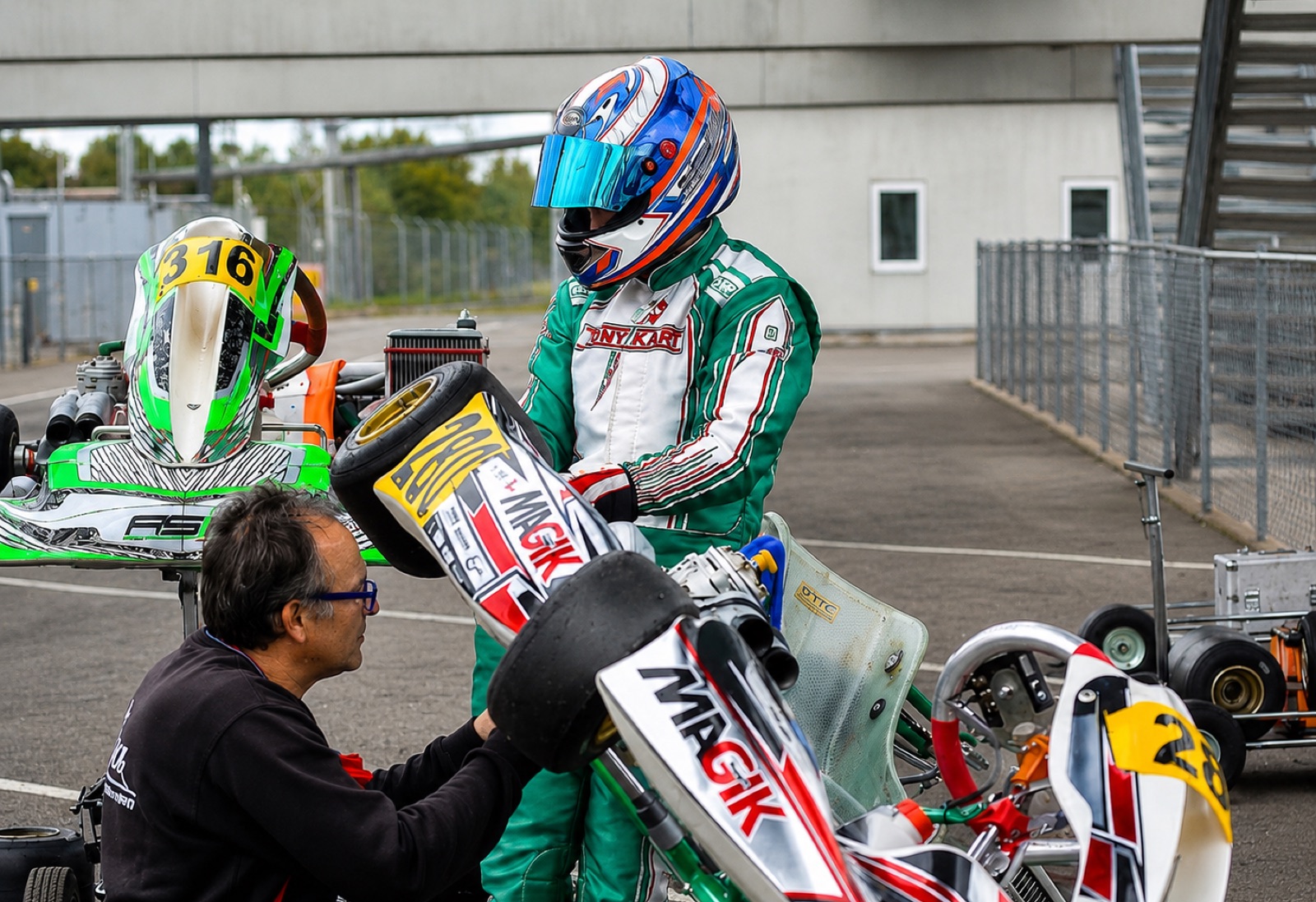 Nico in karting gear next to his shifter kart at Kristianstad before the crash